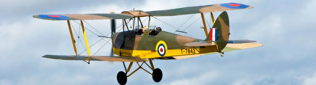 Photograph of the De Havilland D-82a Tiger Moth aircraft flying.