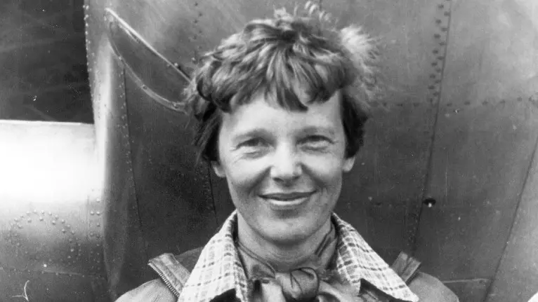 Amelia Earhart smiling at the camera, old photograph.