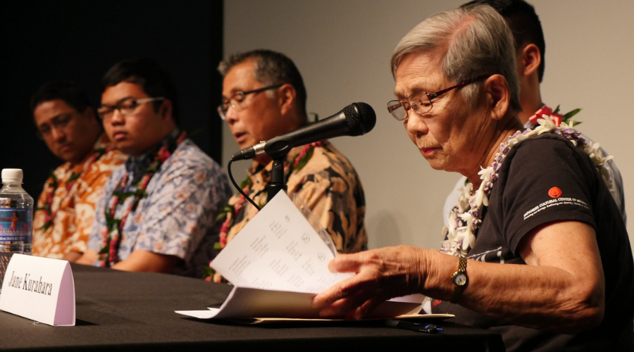 Panelists discussing with Hawaii students and families about how fear and prejudice alter the balance between citizens' rights and the state.
