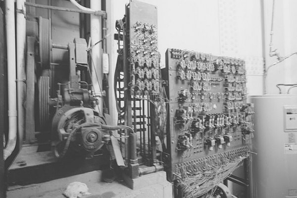 Vintage black and white photo of the elevators machinary.