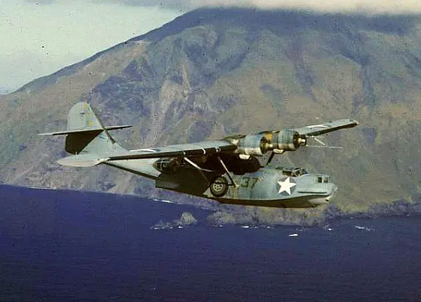 Photograph of PBY Catalina flying through the air.