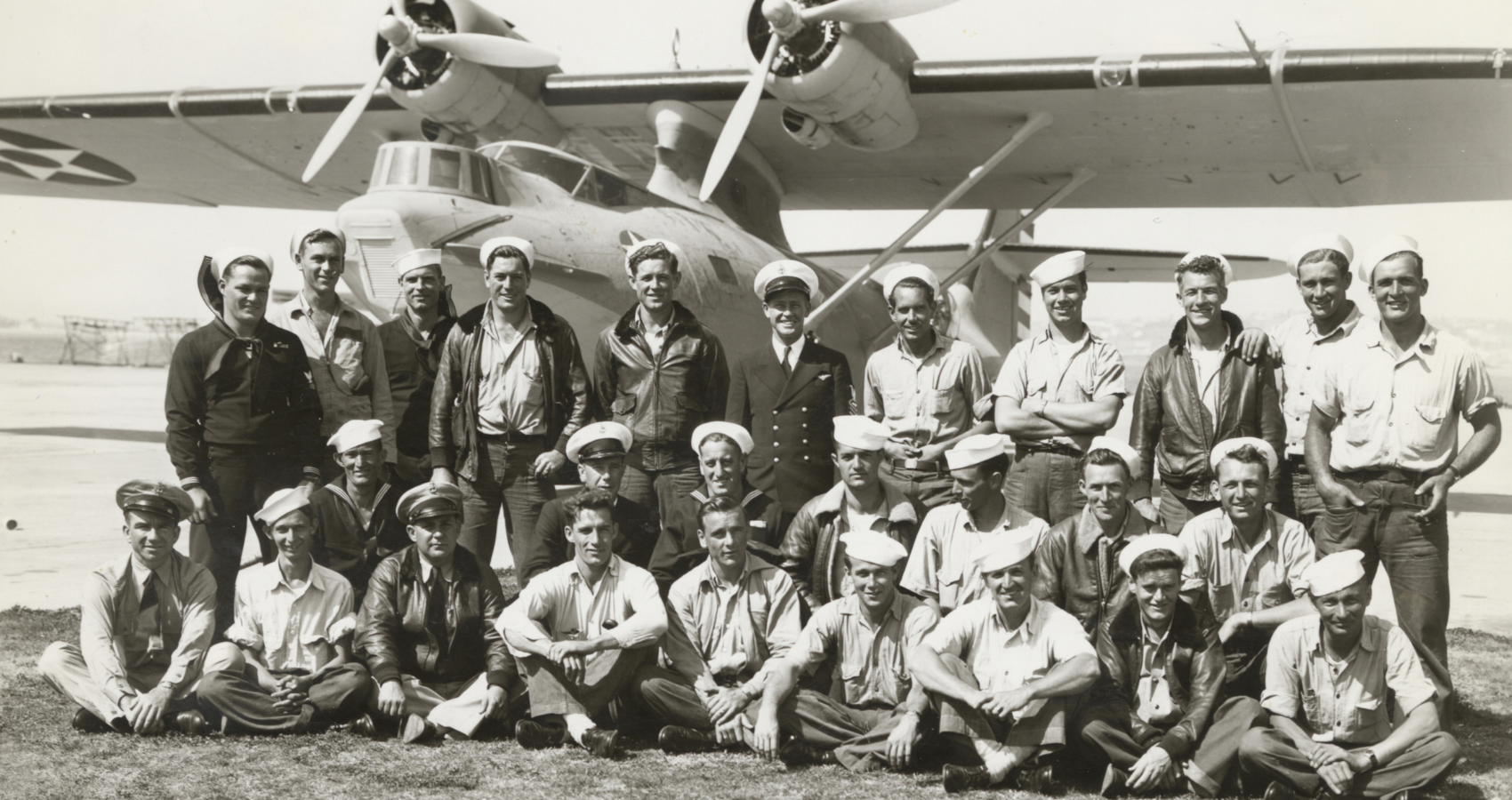 Black and white photograph of the crew of the PBY-5 Aircraft with Chief Aviation Pilot Ken Sederquist.