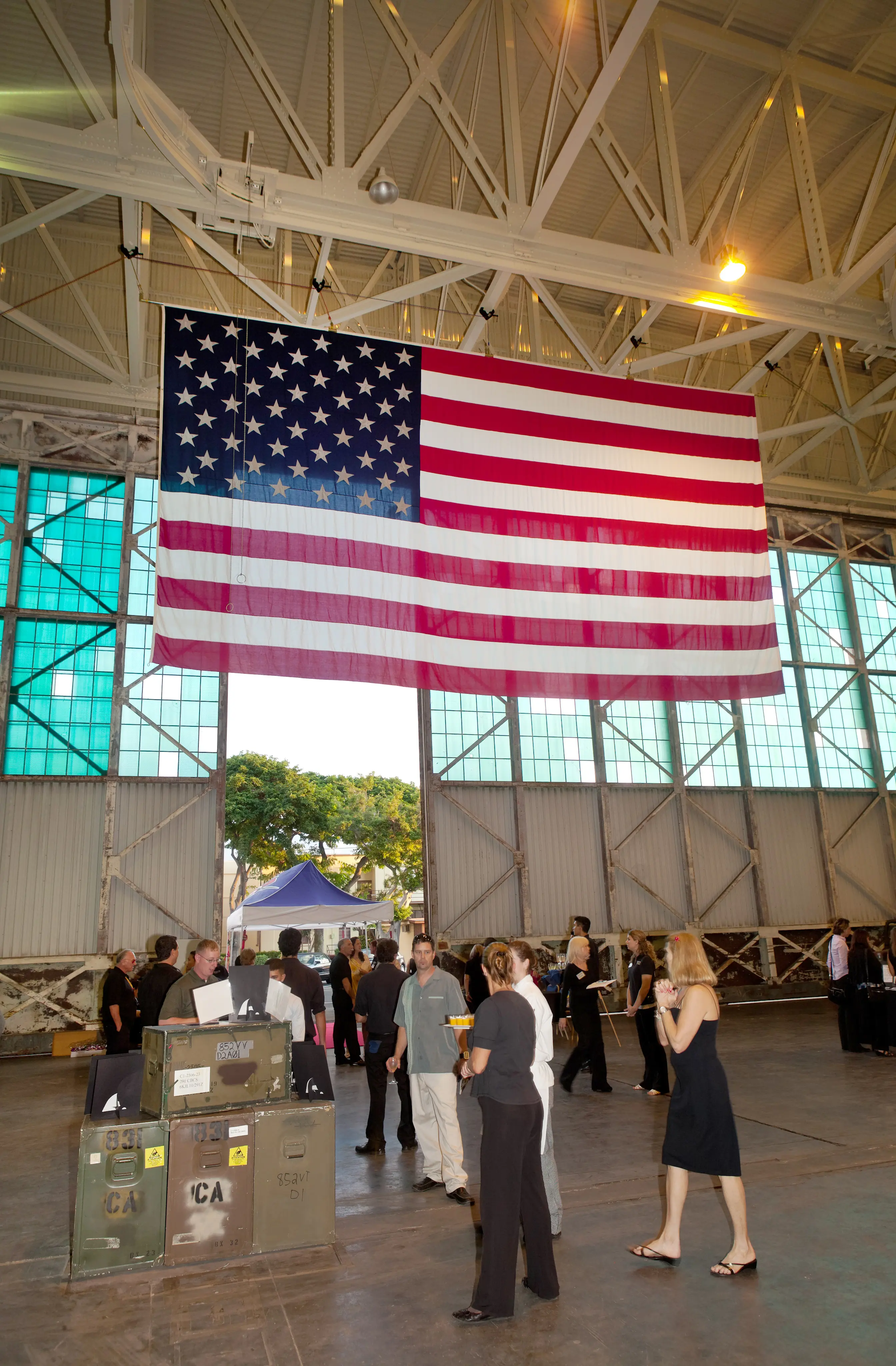 Photo of large flag hanging inside of Hangar 79