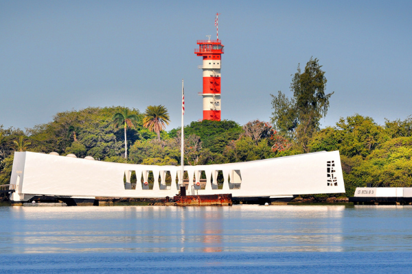 The USS Arizona Memorial with the Ford Island Control Tower behind. 