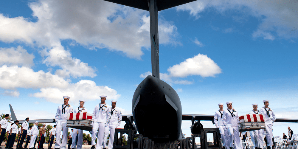 DPAA Desktop 2 DPAA hosts honorable carry as the remains of Unidentified USS Oklahoma Sailors and Marines return to Hawaii.