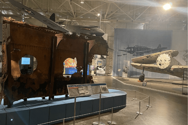 Untitled design (33) The USS Arizona relic on display with Japanese Kate aircraft in view in historic Hangar 37.