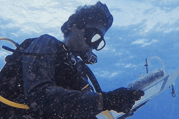 Sunken Treasures 1 Dominic documenting collections and data while diving on a wreck site.