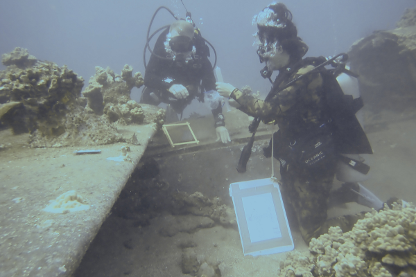 Dominic collecting the exact samples from the site as permitted by the U.S. Navy.