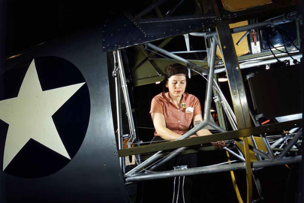World War II Rosie working on the inside of SNV Fuselage.