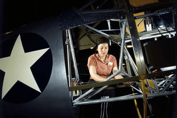 Untitled design - 2021-12-15T100553.405 World War II Rosie working on the inside of SNV Fuselage.