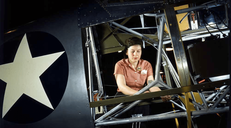 Untitled design - 2021-12-15T100720.728 World War II Rosie working on the inside of SNV Fuselage.