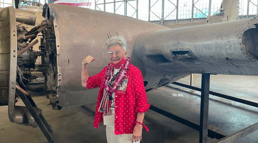 Untitled design - 2021-12-15T101022.016 "Rosie" Mae Krier standing in the location she worked on B-17s during World War II.