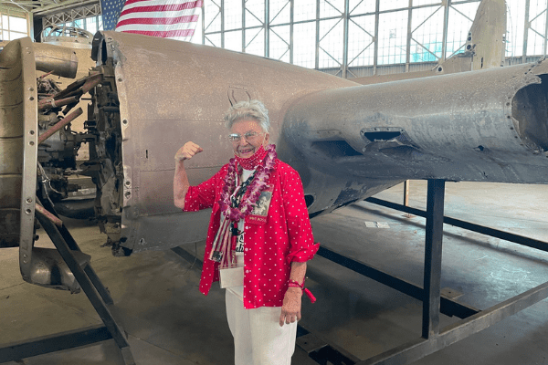 Untitled design - 2021-12-15T101045.298 "Rosie" Mae Krier standing in the location she worked on B-17s during World War II.