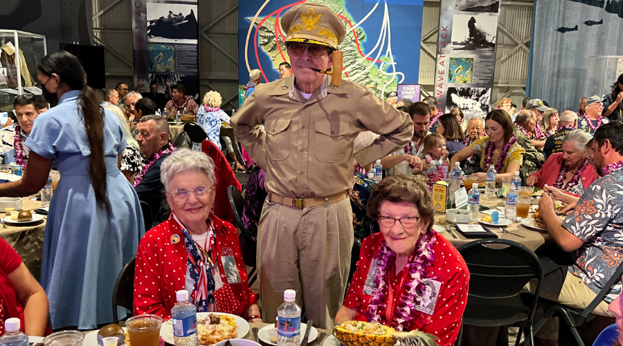 Untitled design - 2021-12-15T101547.964 Mae Krier and Marian Wynn with "General MacArthur" at Liberty Luau at Pearl Harbor.