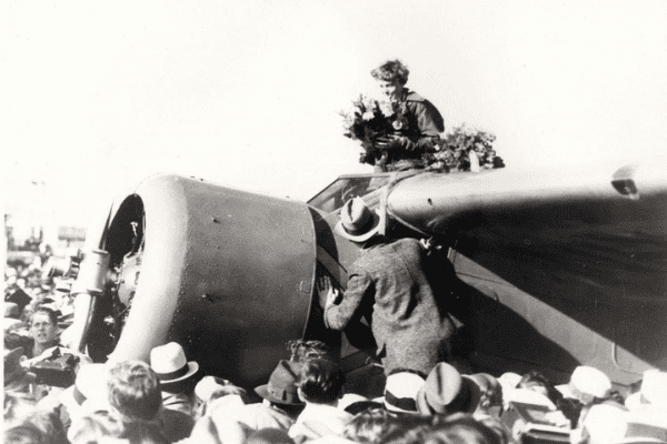 Amelia Earhart Mobile 3 Earhart receiving bouquet after landing at Oakland Field after her flight from Hawaii