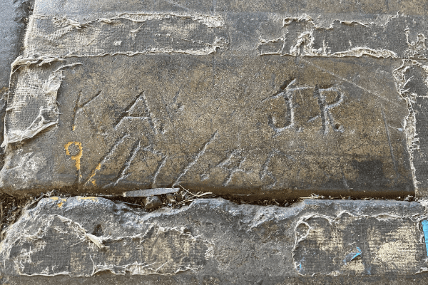 Untitled design - 2022-01-21T131657.640 Carvings found in Hangar 79's floor, dated "9/17/41."