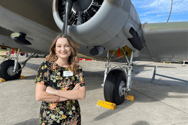 Untitled design (23) Tracie next to the Museum's C-47.