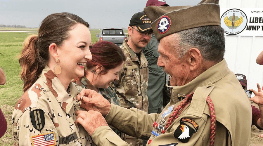 Volunteer Tracie receiving her wings after completing jump school with Liberty Jump Team.