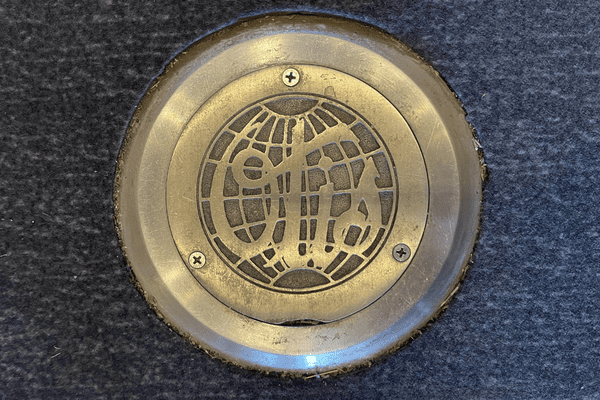 Elevator Blog (1) Historic elevator medallion bearing 1940s OTIS logo.