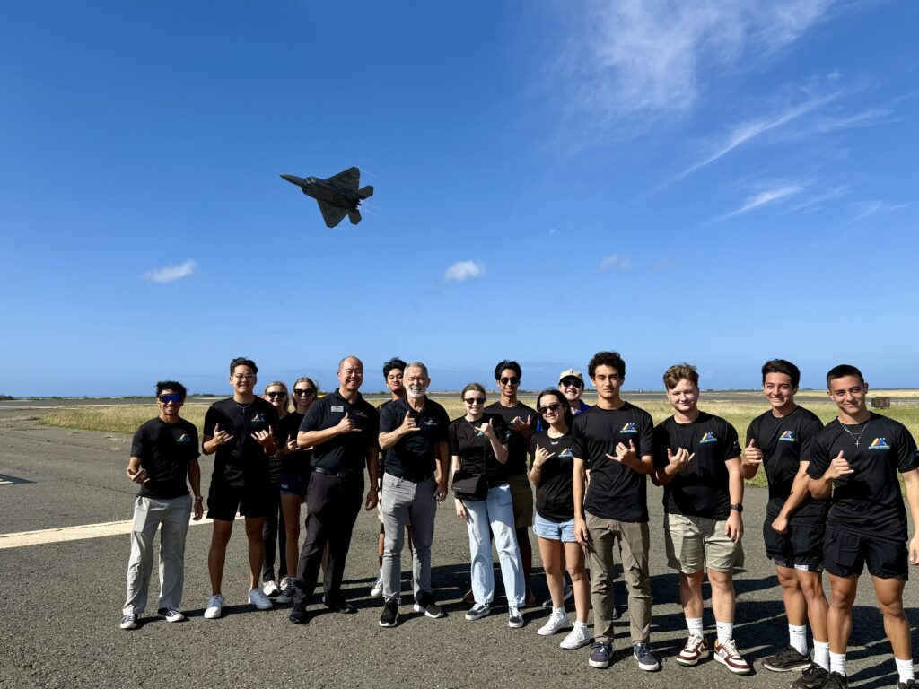Aviation Pathways Pathfinders on a flightline with a F-22 over head